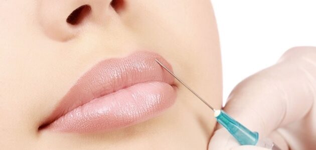 Woman getting a botox injection in her lips