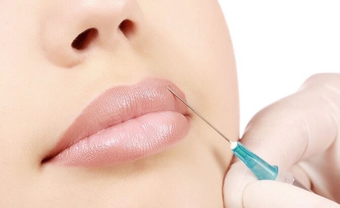 Woman getting a botox injection in her lips