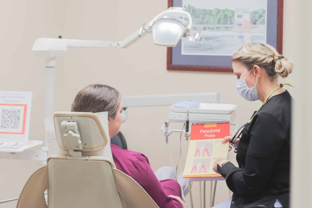 Dental hygienist explaining information to a patient