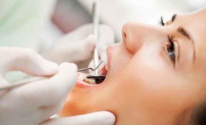 Woman in a dental chair having teeth cleaned